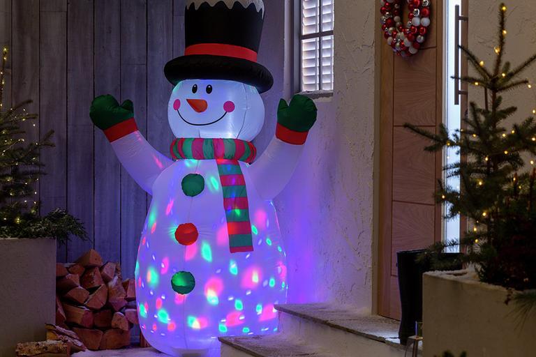 A 6 foot inflatable snowman outside the front door.