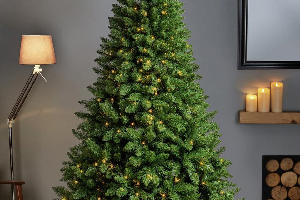 A 7ft Oregon pine artificial Christmas tree in a room.