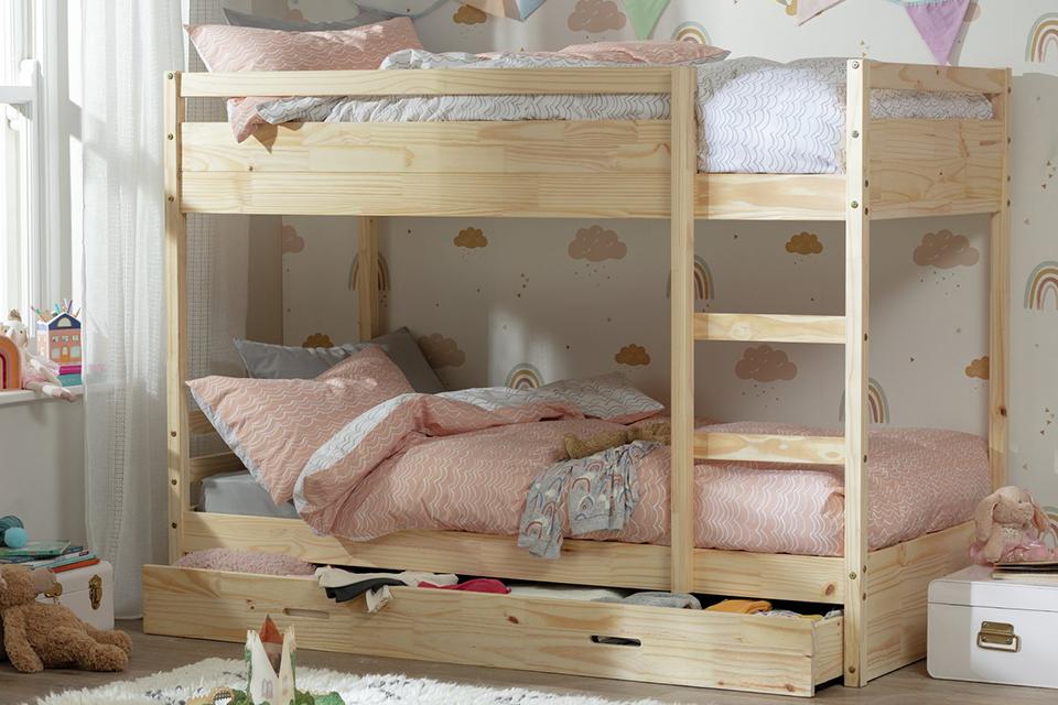 Image of a pine bunk bed in a kids room.