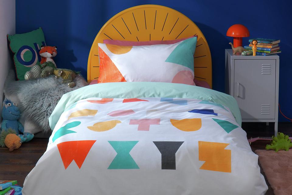 Image of ablue kids room with alphabet bedding.