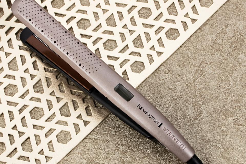 Sleek Remington hair straighteners are shown resting on a heatproof mat.