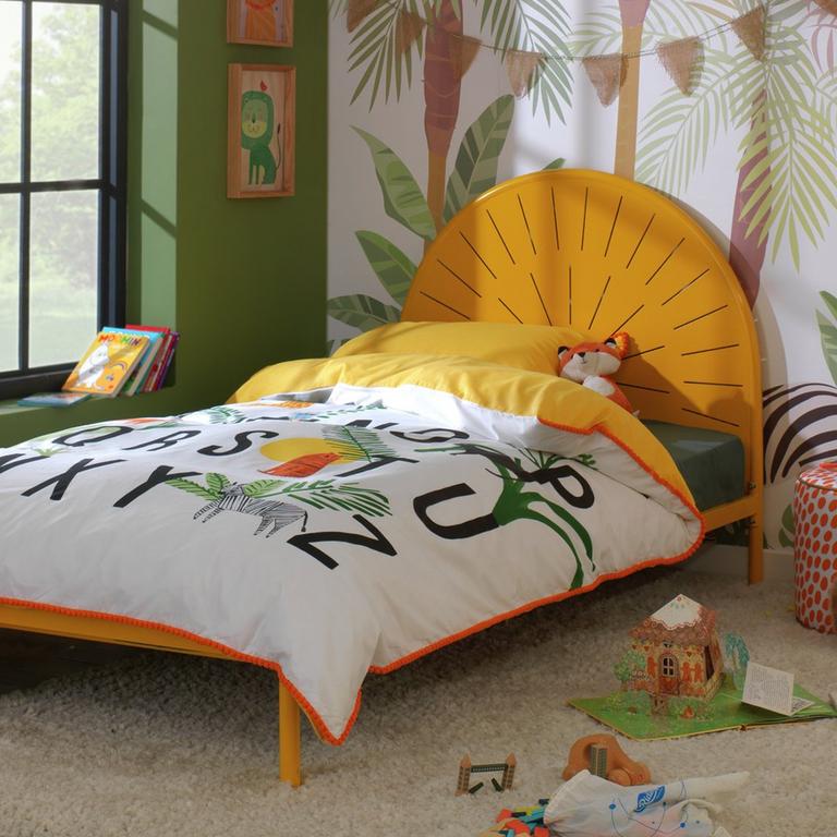 Colourful bed frame and duvet set in nature-themed bedroom.