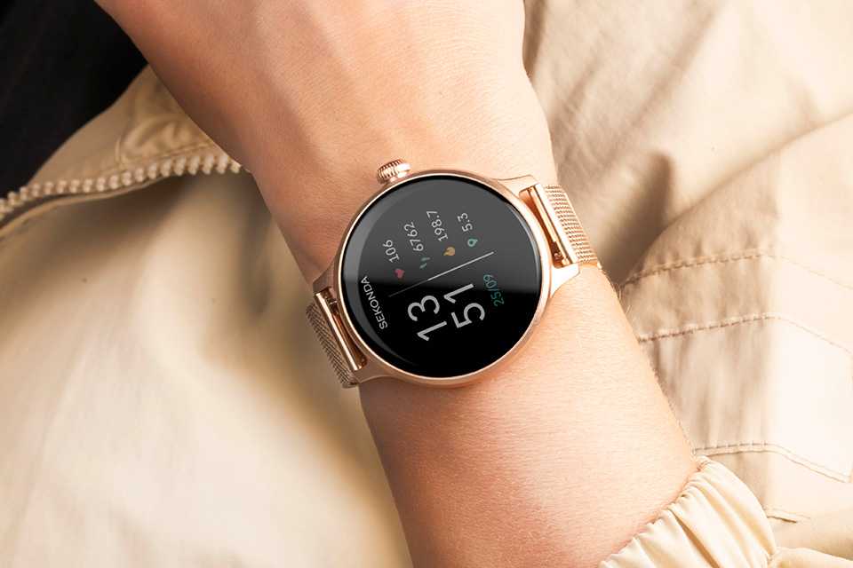 A Sekonda women's gold mesh strap smartwatch on female model.