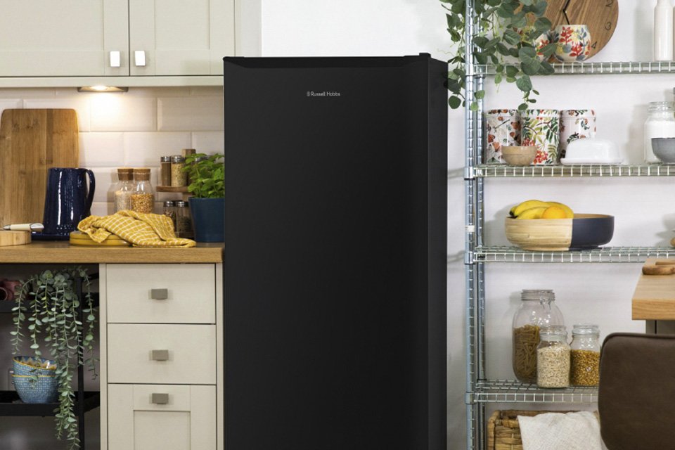 Russell Hobbs black fridge freezer in a kitchen setup.