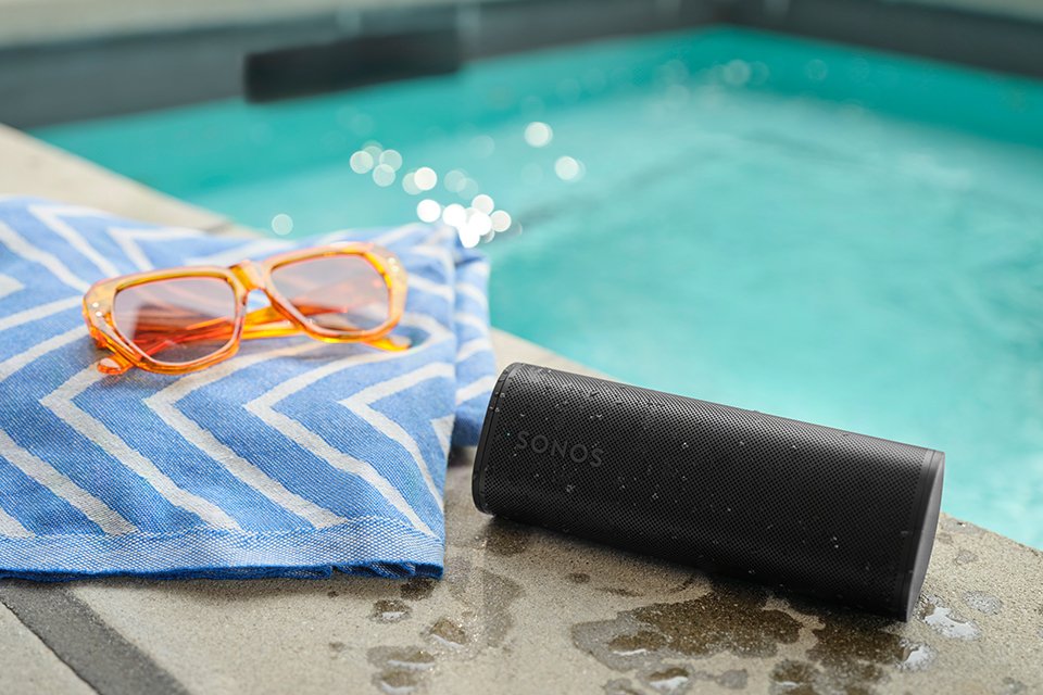 A black Sonos speaker kept poolside.
