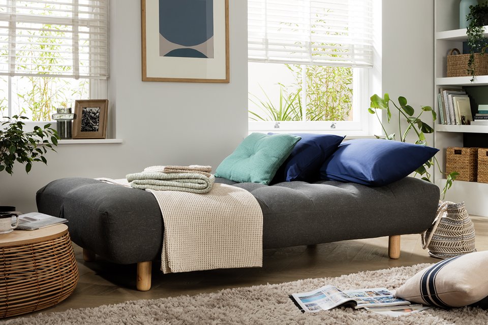 A Habitat fabric 3-seater clic clac sofa bed.