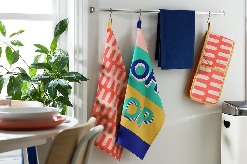 An image of some colourful tea towels and oven gloves.