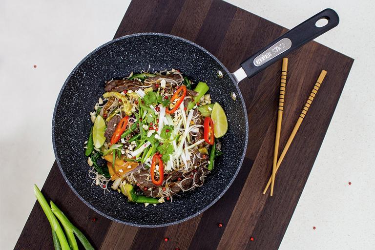 An image of a wok with a stir fry in it.