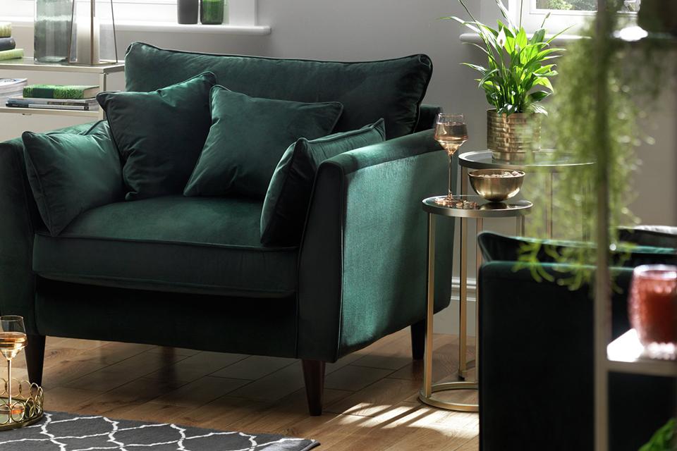 Image of a green, velvet armchair.