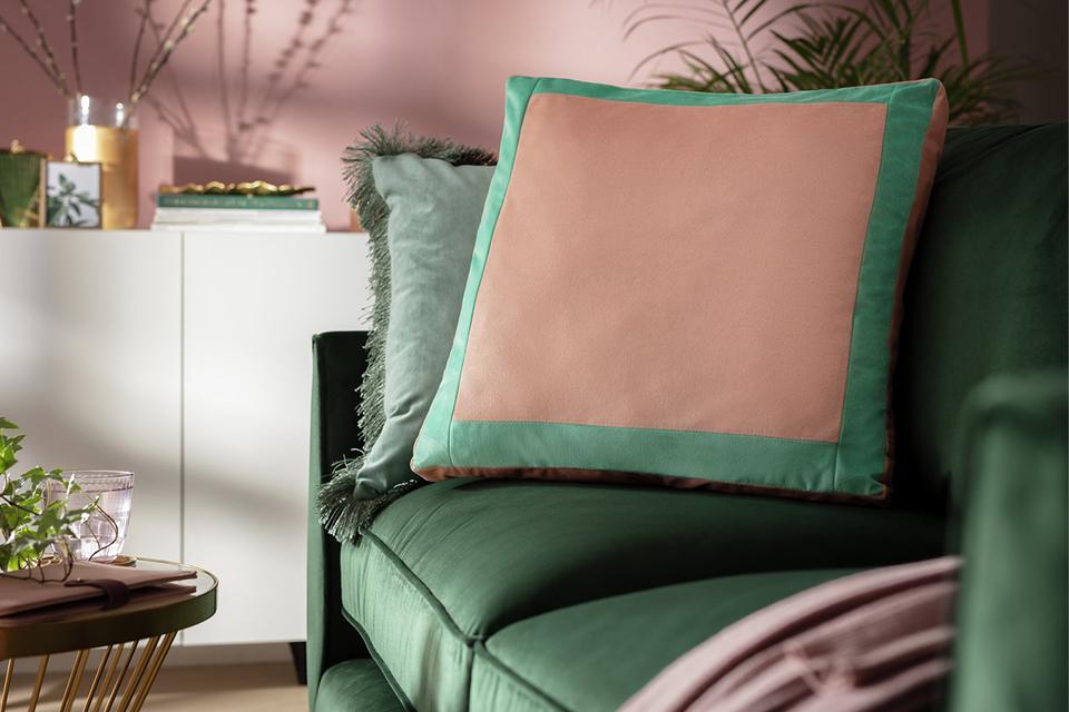 Image of a green, velvet armchair.
