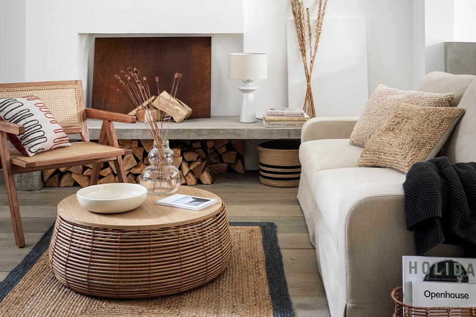 Image of a white and beige living room with jute and rattan furnishings.