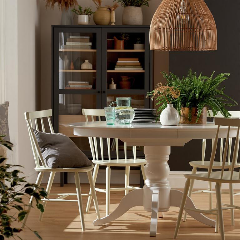 Image of a white dining set in a country style home