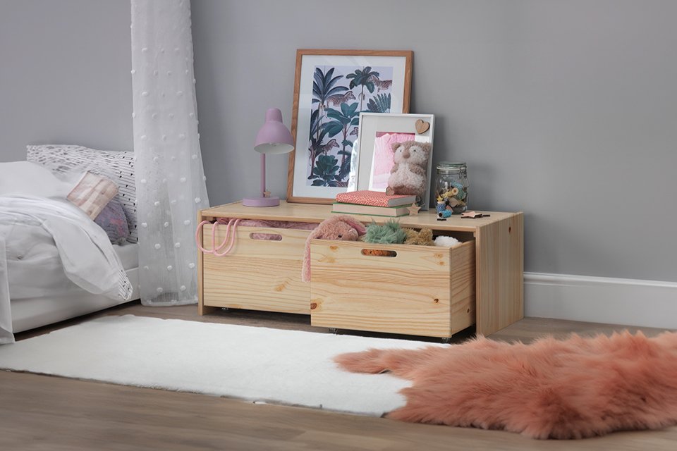A wooden storage chest of drawers.