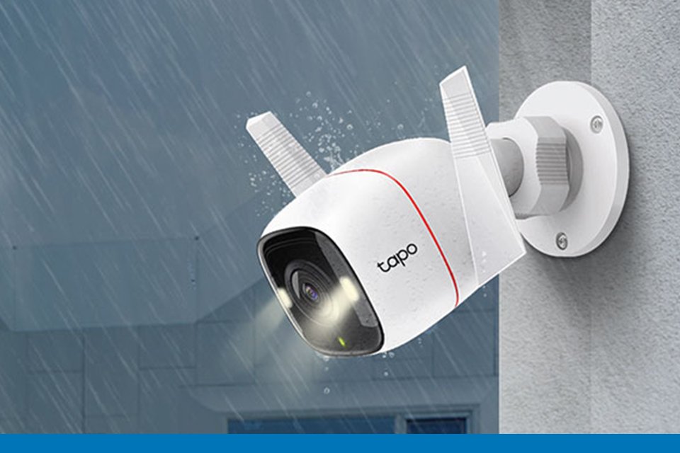 Tapo smart outdoor Wi-Fi security camera installed on outside wall.