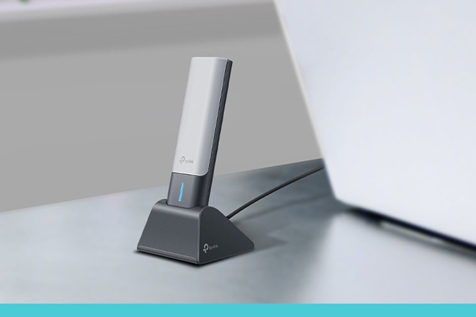 TP-Link USB Wi-Fi adapter in a living room setup.