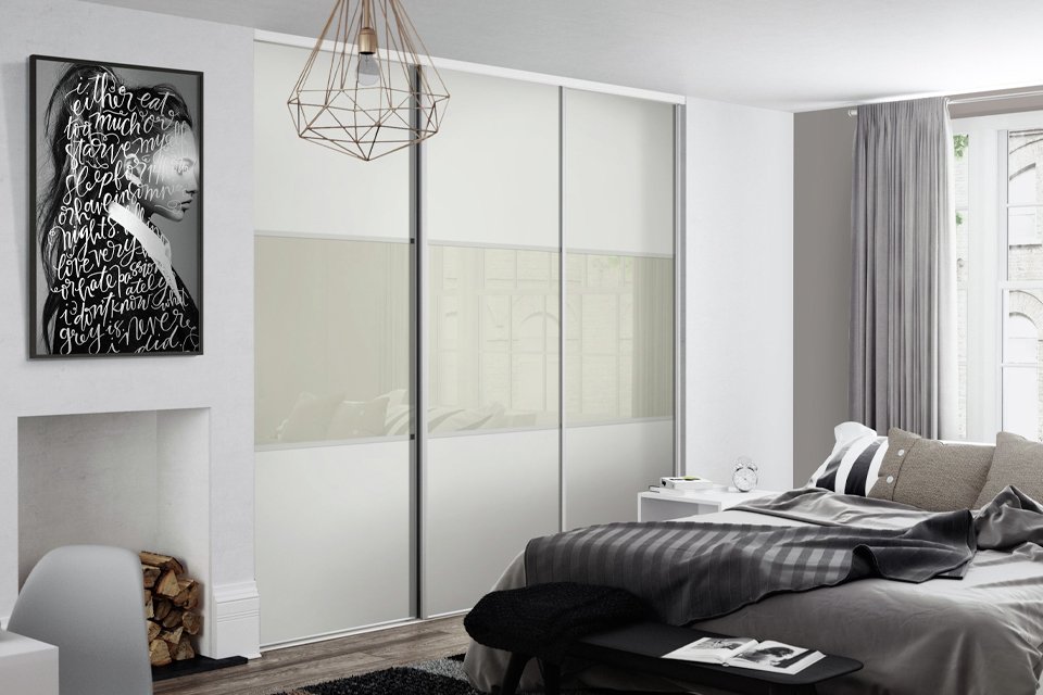 Large fitted wardrobe with sliding doors.