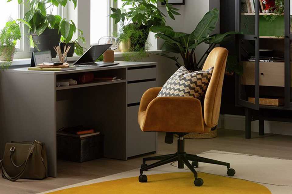 A home office set up with a Habitat 2 drawer desk and a mustard chair.