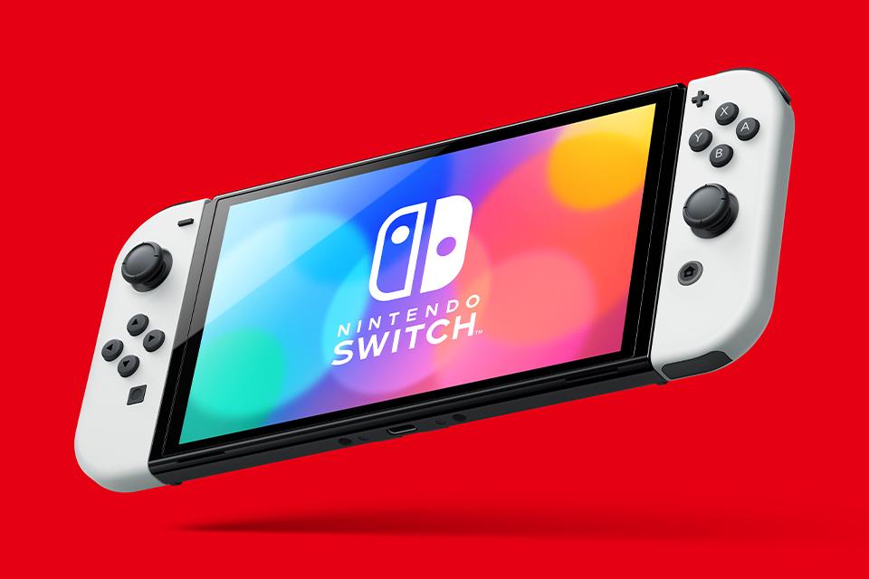 A Nintendo Switch OLED model shown in handheld mode.