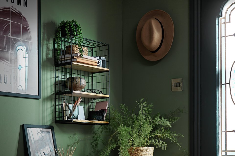 Wooden shelving unit above desk.