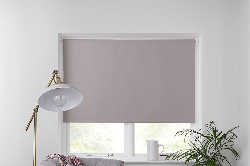 Neutral roller blind in office.