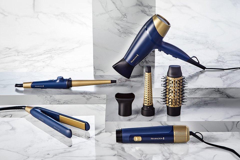 Remington's Sapphire Luxe collection of straightener, hair dryer, curler and more in navy blue and gold colour..