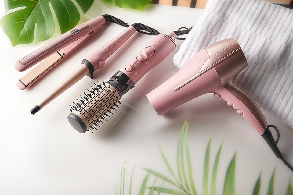 Remington's Coconut Smooth collection of straightener, hair dryer, curlers and more in bbay pink colour. 