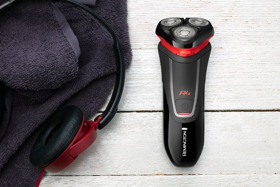 A black and red Remington rotary shaver.