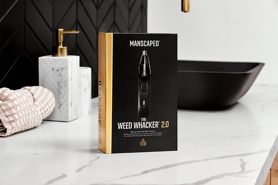 The Manscaped Weed Whacker 2.0 packet kept on an marble bathroom sink.