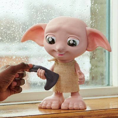 A child playing with Wizarding World Harry Potter Interactive Dobby.