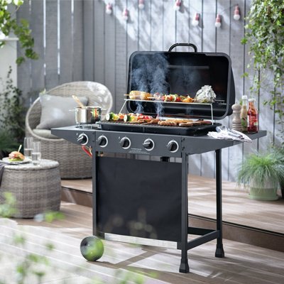 BBQ grilling food in garden.