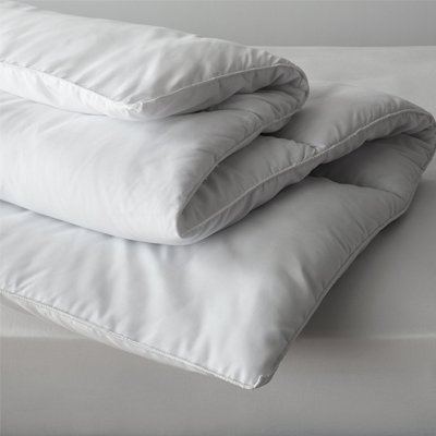 Duvet and pillowcases on mattress.