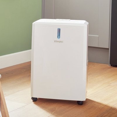 Dimplex 14 Litre Dehumidifier placed in a laundry room.