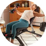 A man riding Cross FXT30 26 inch Wheel Size Mens Mountain Bike.