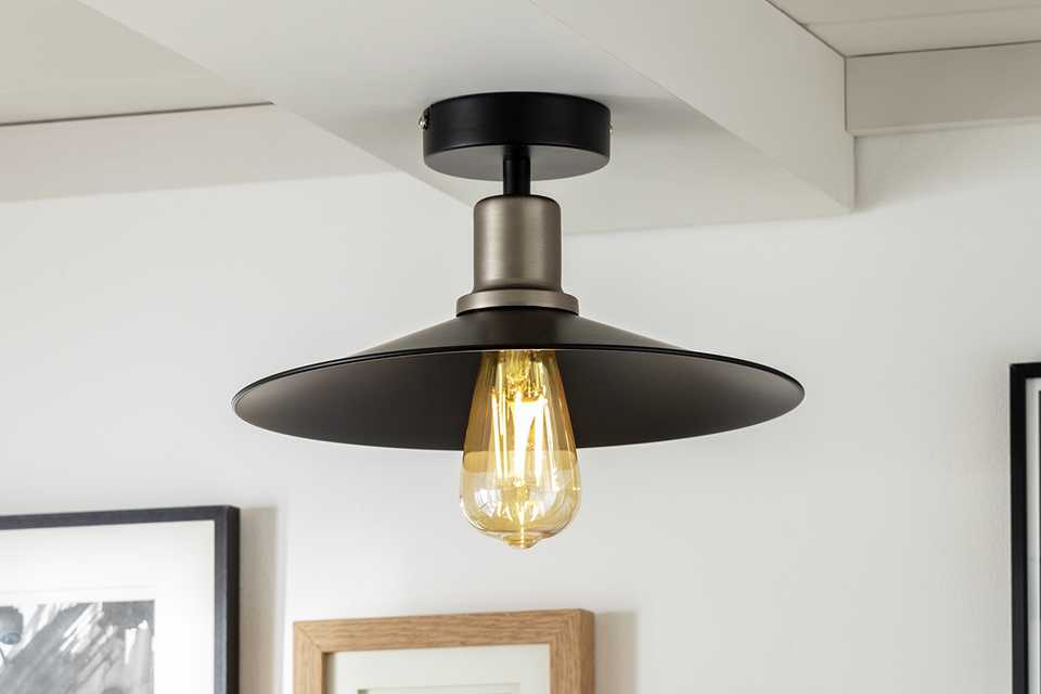 Flush to ceiling light in a smart grey and black metal.