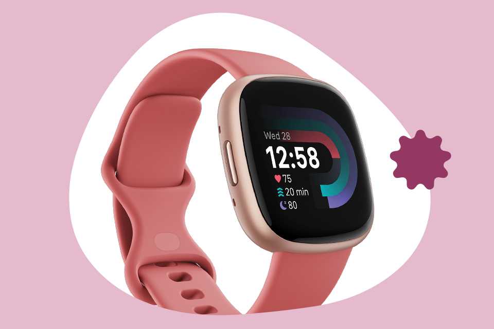 Fitbit Versa 4 with pink strap.