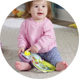 Fisher-Price Purple Monkey Musical Storybook Toy.