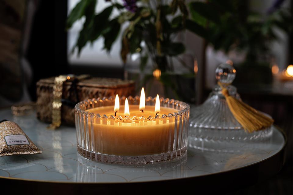Image of a 4-wick candles on a side table.