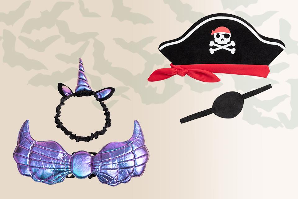A pirate hat alongside a unicorn headband.