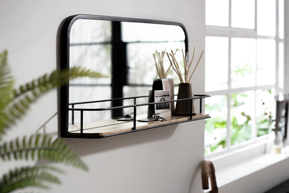 Mirror with shelf attached.