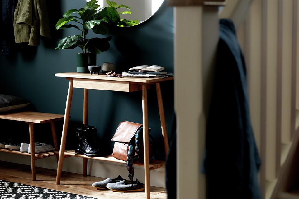 Wooden console table in a hallway.