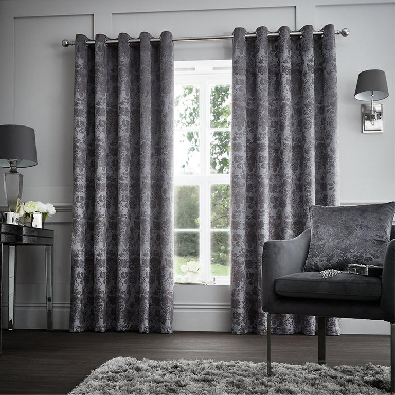 Image of grey crushed velvet lined curtains.