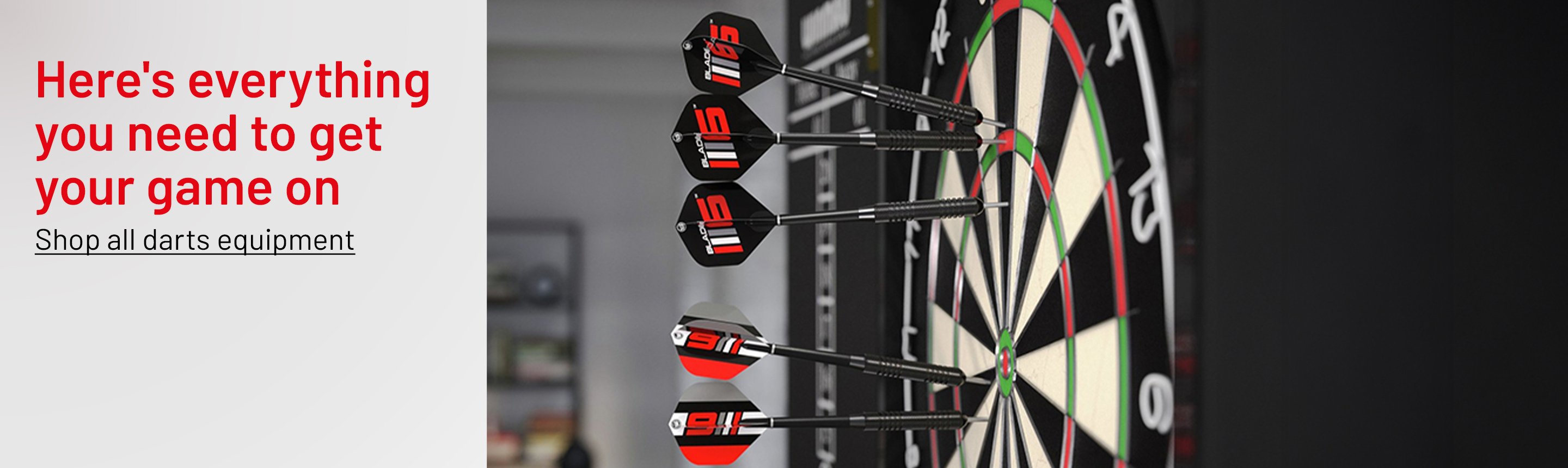 Winmau Blade 6 championship dartboard and darts set.