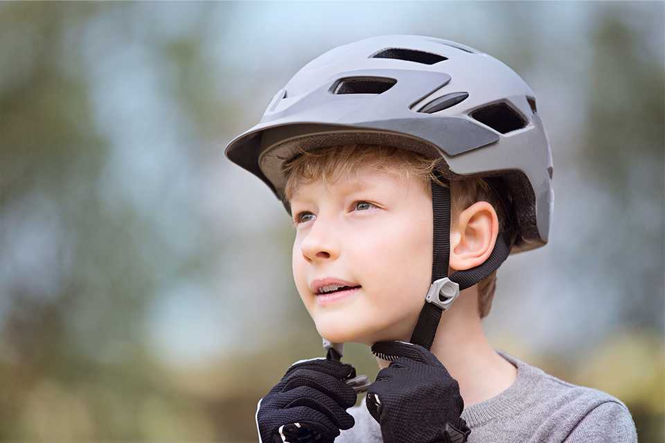 Fitting a child's bike helmet.