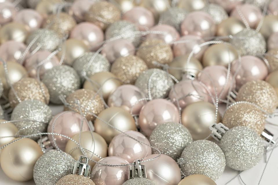 Image of a selection of pink, silver and gold baubles.