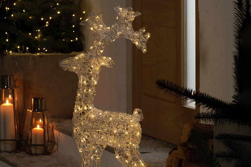 Image of an outdoor light up reindeer decoration.