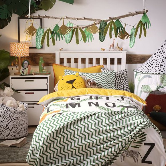 Kids bedroom with single white bedframe and wildlife bedding.