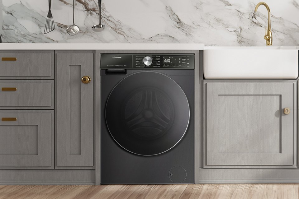 A Hisense S series washing machine placed in the laundry room.