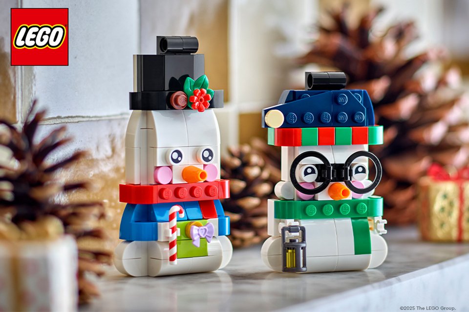 LEGO® snowman and penguin minifigures displayed on a table.