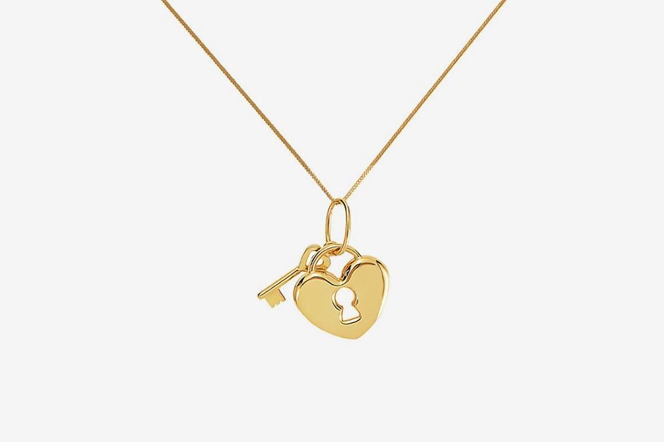 Yellow gold heart lock pendant necklace.