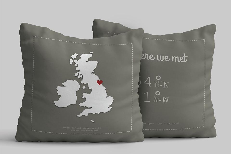 A set of grey customised cushions with a map print.
